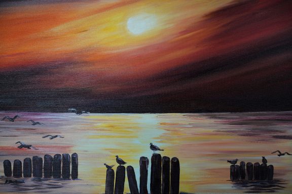 Sonnenuntergang Nr.33 70x50 Sonnenuntergang am Meer. Die Buhnen und die Möwen sind nur nach Schatten im Gegenlicht.